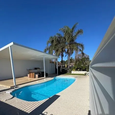 Exposed aggregate pool surround by CoastCrete